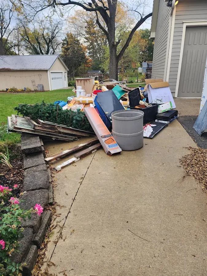 Dumpster being loaded with debris for Roofing Dumpster Rental in East Hanover